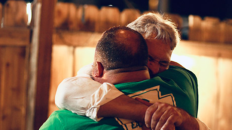 2 men hugging